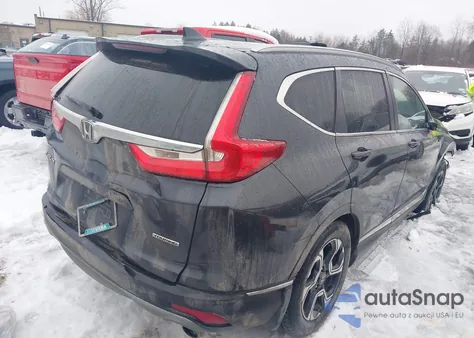 2019 Honda Cr-V Touring z USA, uszkodzony, nr VIN 7FARW1H90KE013970